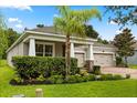 Beautiful home with a three-car garage, lush landscaping, and a brick driveway at 31924 Geoff, Sorrento, FL 32776