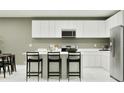Beautiful kitchen with a large island and stainless steel appliances at 373 Sol Vista Dr, Dundee, FL 33838