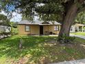 Charming single-story home featuring a quaint front porch and well-maintained lawn at 4035 Nimons St, Orlando, FL 32811