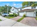 Charming home exterior featuring an attached two car garage and well maintained landscaping at 6931 Sperone St, Orlando, FL 32819