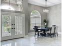 Foyer featuring modern lighting, and a view of the formal dining room at 704 Forest View Ct, Winter Springs, FL 32708