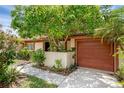Single-story home features an attached garage, manicured landscaping, and welcoming curb appeal at 1032 Calanda Ave # 1032, Orlando, FL 32807