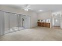 Spacious living room with a large sliding door and a convenient pass-through to the kitchen at 1032 Calanda Ave # 1032, Orlando, FL 32807