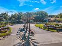 Beautifully landscaped entrance to Mirada community featuring mature palm trees and decorative signage at 2065 Dixie Belle Dr # O, Orlando, FL 32812