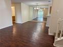 Open-concept living space featuring wood flooring and neutral walls, perfect for seamless entertaining and relaxation at 3713 S Lake Orlando Pkwy # 6, Orlando, FL 32808