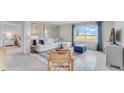 Bright living room with a large window, comfortable seating, and stylish decor at 5174 Masser Rd, St Cloud, FL 34772