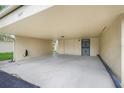 Spacious carport featuring ample room for parking and storage, with convenient access to the home at 208 Sonora Drive # 208, Casselberry, FL 32707