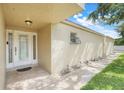 Charming front entryway with decorative glass door, enhanced by manicured landscaping at 208 Sonora Drive # 208, Casselberry, FL 32707