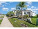 Attractive home exterior showcasing manicured lawn and walkway on a sunny day at 3110 Areca Ave, New Smyrna Beach, FL 32168