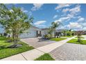 Well-maintained community street view featuring manicured lawns and paved sidewalks at 3110 Areca Ave, New Smyrna Beach, FL 32168