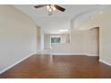 Bright living room featuring tile floors, a ceiling fan, and an open layout at 3313 Buckland St, Deltona, FL 32738