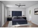 Serene main bedroom featuring a plush bed, ceiling fan, and elegant decor at 3492 Lemon Button Ter, Apopka, FL 32712