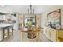 Tastefully decorated dining room with sliding glass doors, neutral color palette, and stylish furnishings at 3531 Reston Dr, The Villages, FL 32162