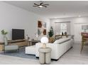 Open-concept living room with sleek furniture, stylish decor, and modern lighting fixtures at 5381 Sw 128Th Street Rd, Ocala, FL 34473