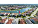 Aerial view showcases this beautiful two-story home, nestled in a vibrant community with scenic views of the surrounding lakes at 10427 Royal Cypress Way, Orlando, FL 32836