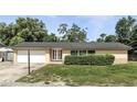 Charming one-story home with a well-manicured front yard and attached garage at 161 Peacock, Altamonte Springs, FL 32701