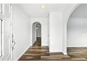Bright foyer featuring wood-look floors and arched doorways at 161 Peacock, Altamonte Springs, FL 32701