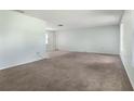 Bright living room with carpet and tile floors, fresh paint, and plenty of natural light at 247 Carmen Ln, Debary, FL 32713