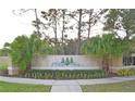 Victoria Pines community entrance with decorative signage, landscaping, and elegant pillars at 3321 Wilshire Way Rd # 6, Orlando, FL 32829