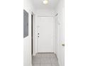 Bright entryway with tile floors, white walls, and a white front door at 4403 S Semoran Blvd # 3, Orlando, FL 32822