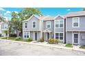 Charming two-story townhome featuring a welcoming entrance, well-maintained landscaping, and ample parking at 4443 Brook Hollow Cir # 19A, Winter Springs, FL 32708