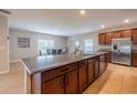 Spacious kitchen island with granite countertops and stainless steel appliances at 565 Ogelthorpe Dr, Davenport, FL 33897