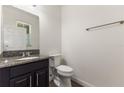 Well-maintained powder room featuring a granite vanity and neutral fixtures for a clean, modern look at 7816 Winter Wren St, Winter Garden, FL 34787