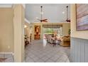 Spacious living room with tile flooring, fan, and a view of screened-in patio at 2508 Fawn Run, Oviedo, FL 32765