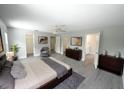 Spacious main bedroom with wood-look floors and ensuite bathroom at 14308 Abington Heights Dr, Orlando, FL 32828