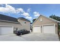 Attached garage with multi-car capacity and convenient access to the main house at 1865 S Tanner Ct, Deltona, FL 32738