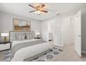 Neutrally decorated main bedroom with ensuite bath and walk-in closet, showcasing wood-look tile flooring at 236 Afton Sq # 109, Altamonte Springs, FL 32714
