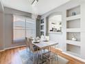 Stylish dining room with modern chandelier, adjacent butler's pantry, and dining table set for six at 2705 Grand Harbour Ct, Kissimmee, FL 34747