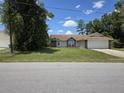Charming single-story home featuring a brick facade and a two-car garage at 2798 Beckwith St, Deltona, FL 32738