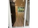 Inviting entryway showcasing modern flooring that flows seamlessly into the light-filled living space at 3 Spur Ct, Kissimmee, FL 34743
