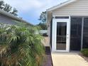 Outdoor living with screened in lanai, offering a seamless transition between indoors and outdoors at 3328 Davis Ter, The Villages, FL 32163