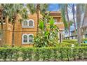 Stunning close-up of a stucco home showcasing tropical landscaping and architectural charm at 337 Cathcart Ave # 6, Orlando, FL 32803