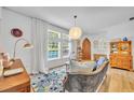 Inviting living room with large windows, wood floors, and stylish decor at 337 Cathcart Ave # 6, Orlando, FL 32803