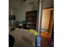 Bedroom featuring a four-poster bed, built-in shelving and ample storage space at 3810 Se 22Nd Pl, Ocala, FL 34471