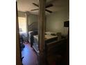Bedroom with a four-poster bed and good natural light, perfect for relaxation and comfort at 3810 Se 22Nd Pl, Ocala, FL 34471