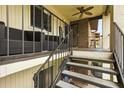 Second story balcony with seating and stairs at 563 Belltower Ave # 240, Deltona, FL 32725