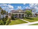 Charming single-story home with a welcoming porch and beautifully landscaped front yard at 9115 Longship Aly, Orlando, FL 32832