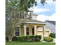 Inviting two-story home with an attached garage and manicured green lawn at 9223 Leeland Archer Blvd, Orlando, FL 32836