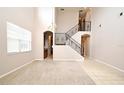 Bright living room featuring staircase and neutral colors at 9223 Leeland Archer Blvd, Orlando, FL 32836