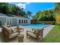 Beautiful backyard with a refreshing pool and stylish outdoor furniture on a sunny day at 1309 W Yale St, Orlando, FL 32804