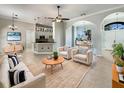 Open-concept living room featuring tile flooring, neutral tones, and lots of natural light at 13108 Long Pine Trl, Clermont, FL 34711