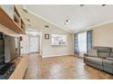 Spacious living room with tile flooring and vaulted ceilings at 145 Lakeside Cir, Sanford, FL 32773