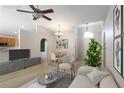 Bright living room featuring modern furniture and an open layout to the dining area at 16603 Corner Lake Dr, Orlando, FL 32820