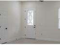 Bright entryway featuring a decorative glass door and white trim at 1868 14Th St, Orange City, FL 32763