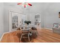 Breakfast nook with white table, chairs, and natural light from the french doors at 19630 County Road 455, Clermont, FL 34715