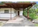 Spacious carport area providing covered parking and easy access to the home's side entrance at 206 Gerry Dr, Altamonte Springs, FL 32714